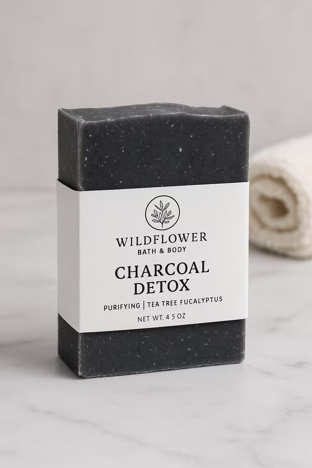 A product photo of Handcrafted Soap Bar from Wildflower Bath & Body in the 'Charcoal Detox' scent.