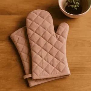 A product photo of Quilted Oven Mitts (Pair) from Hearthcraft Linens in the Blush colour.