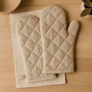 A product photo of Quilted Oven Mitts (Pair) from Hearthcraft Linens in the Natural colour.