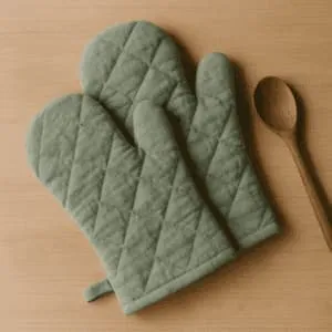 A product photo of Quilted Oven Mitts (Pair) from Hearthcraft Linens.