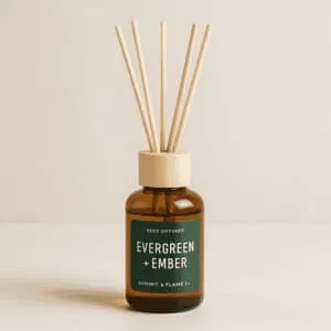 A product photo of Reed Diffuser from Summit & Flame Co. in the 'Evergreen + Ember' scent.