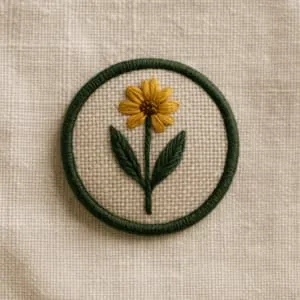 A product photo of Embroidered Patch from Thimble & Thicket featuring the 'Wildflower Emblem' motif.