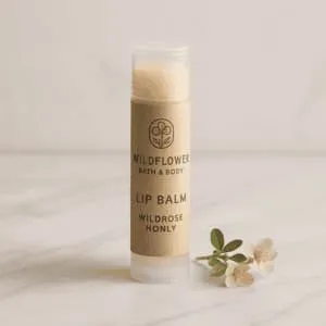 A product photo of Wildrose Honey Lip Balm from Wildflower Bath & Body.
